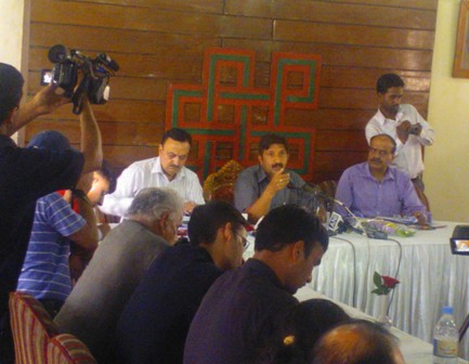 Industry minister Mukesh Agnihotri talking to reporters