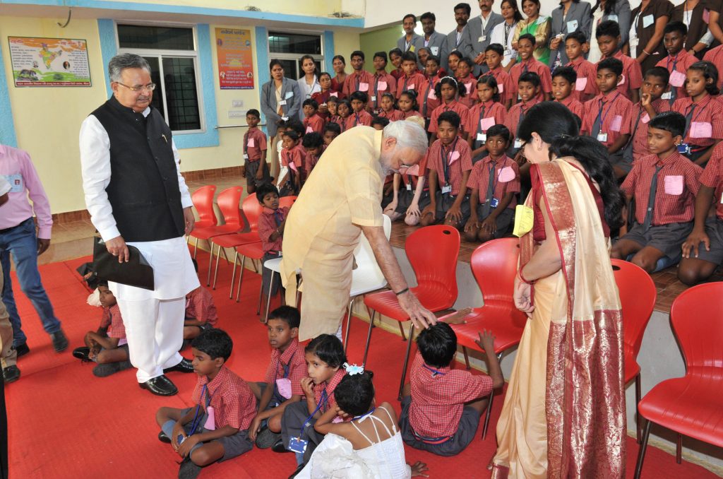 The Prime Minister, Shri Narendra Modi interacting with specially abled children, at Saksham Education City, Jawanga, Dantewada, in Chhattisgarh on May 09, 2015. The Chief Minister of Chhattisgarh, Dr. Raman Singh is also seen.